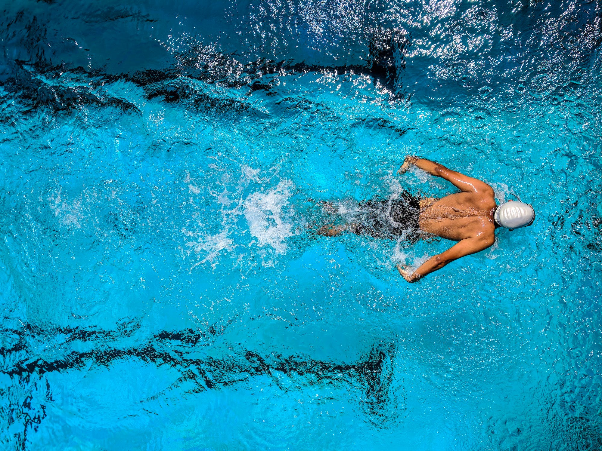 A man diving into the swimming pool